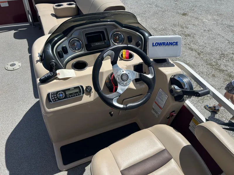Slide: The Image of 2018 Sun Tracker Party Barge 22 DLX XP3 dashboard with steering wheel and Lowrance device. - 4