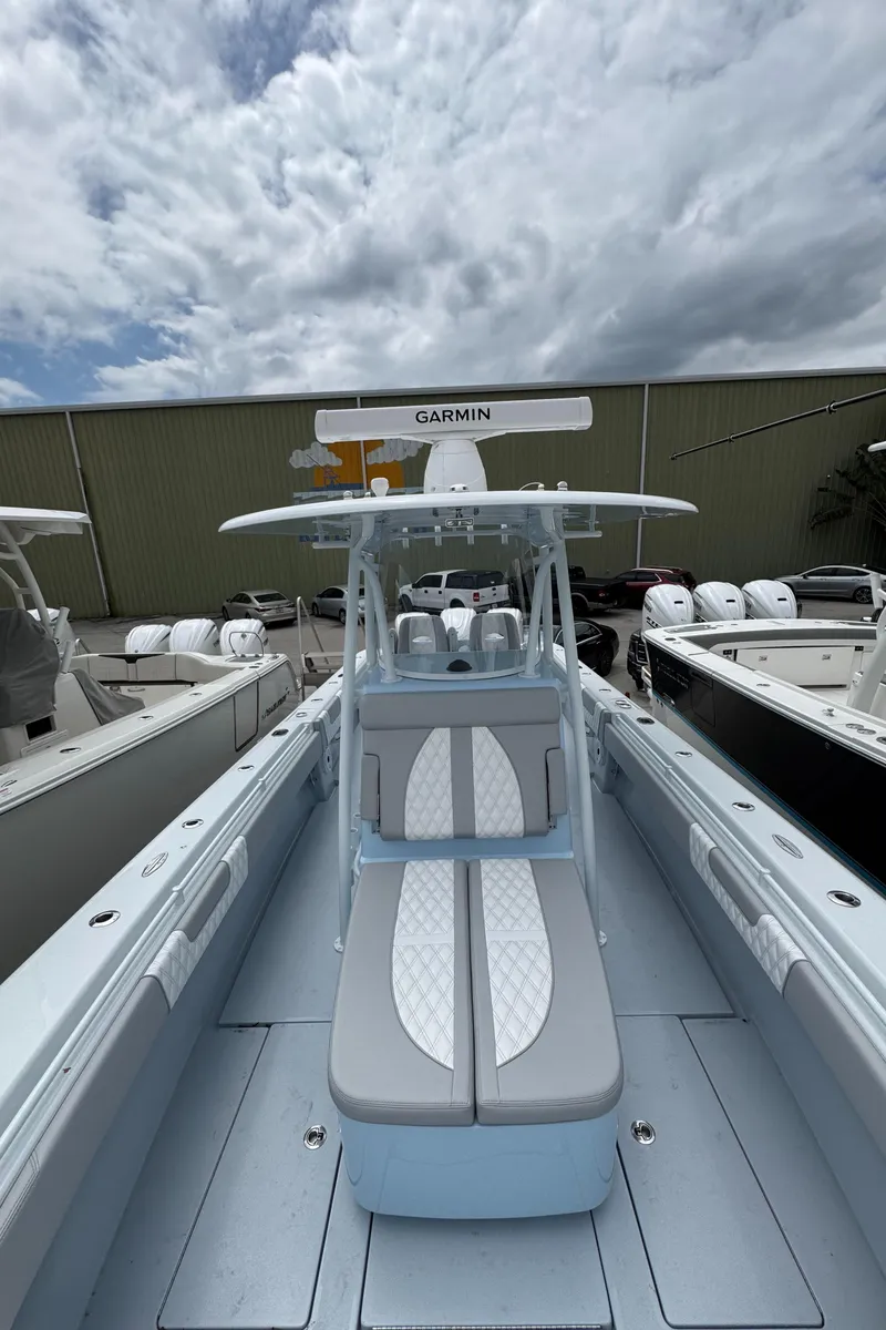 Slide: The Image of 2025 Contender 35 ST boat with sleek design and advanced Garmin navigation system. - 8
