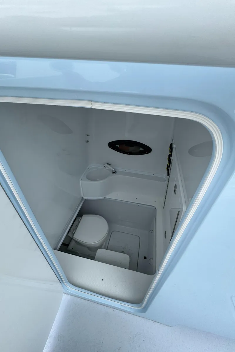 Slide: The Image of 2025 Contender 35 ST boat interior bathroom with compact design and modern amenities. - 9