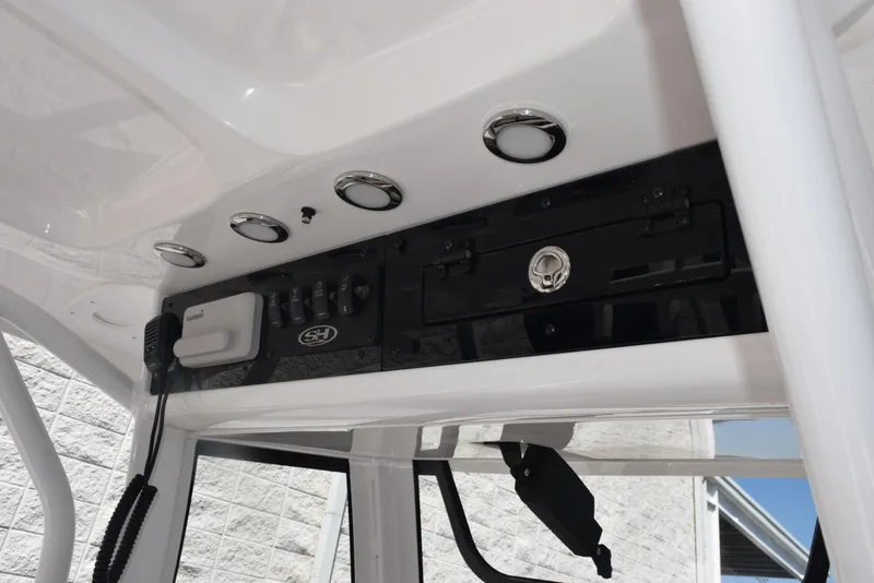 Slide: The Image of Control panel of 2025 Sea Hunt Ultra 255 SE boat with modern features. - 10