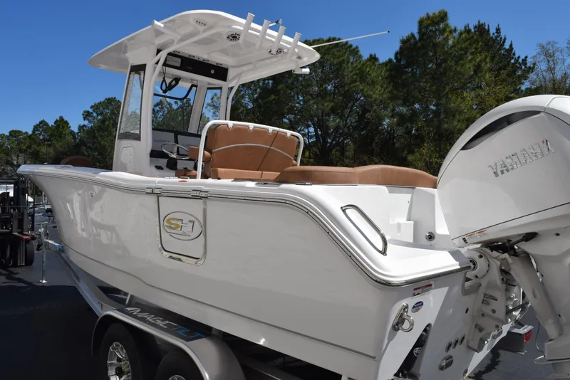 Slide: The Image of 2025 Sea Hunt Ultra 255 SE boat with Yamaha engine, parked on trailer. - 5