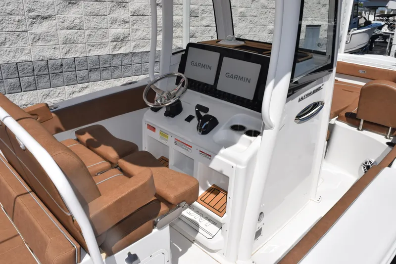 Slide: The Image of Interior view of 2025 Sea Hunt Ultra 255 SE boat with Garmin navigation system. - 8