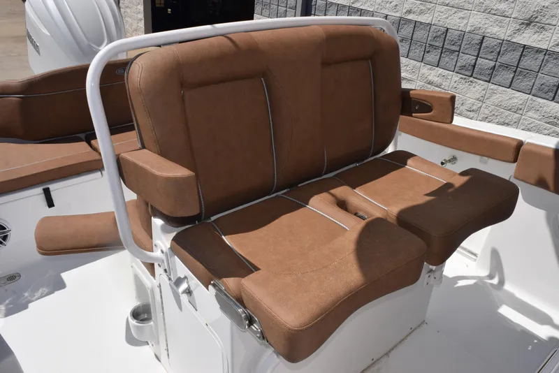Slide: The Image of Brown cushioned seating on 2025 Sea Hunt Ultra 255 SE boat deck. - 9
