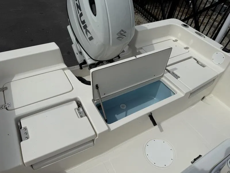 Slide: The Image of 2025 Bulls Bay 2200 XS boat with Suzuki engine, open storage compartments. - 12