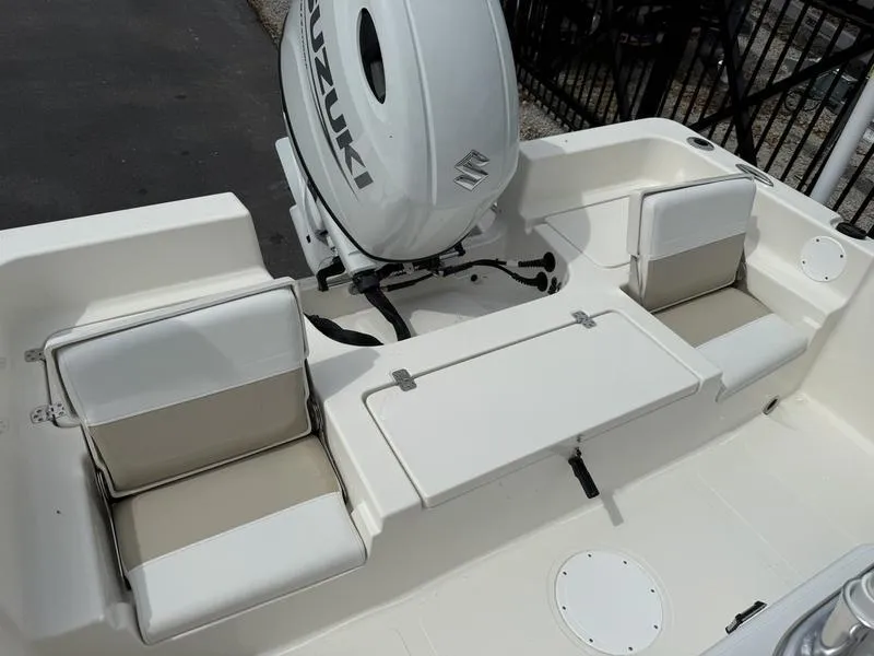 Slide: The Image of 2025 Bulls Bay 2200 XS boat with Suzuki outboard motor and seating area. - 13