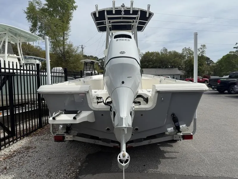 Slide: The Image of 2025 Bulls Bay 2200 XS boat, rear view, parked outdoors. - 4