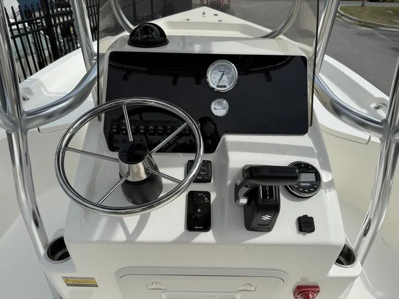Slide: The Image of 2025 Bulls Bay 2200 XS boat console with steering wheel and controls. - 8