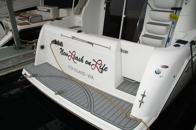 Slide: The Image of 2004 Meridian 340 yacht with "New Leash on Life" name, docked at Fox Island, WA. - 10