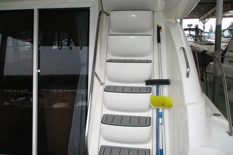 Slide: The Image of Staircase on a 2004 Meridian 340 yacht with cleaning tools attached. - 12