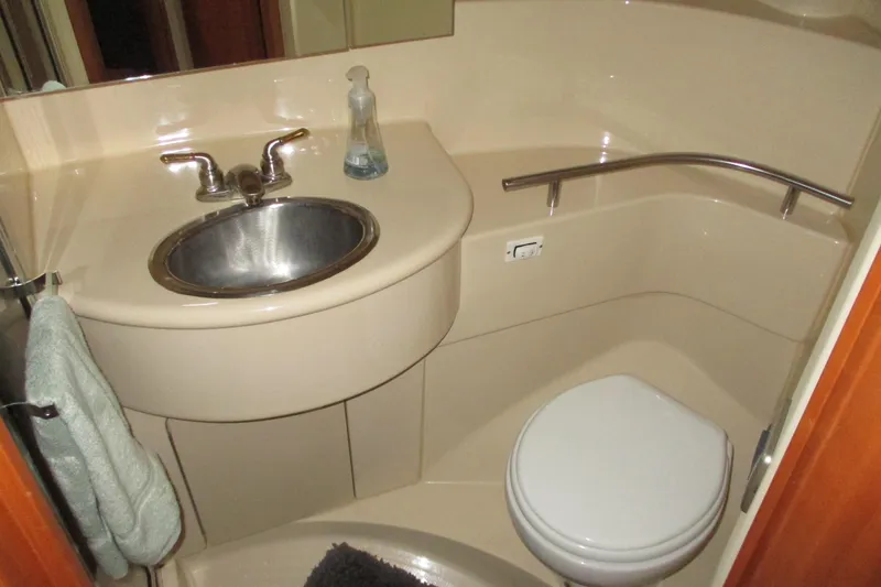 Slide: The Image of Bathroom interior of 2004 Meridian 340 yacht with sink and toilet. - 32
