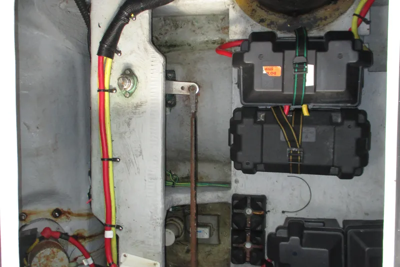 Slide: The Image of 2004 Meridian 340 engine compartment with wiring and battery boxes. - 33