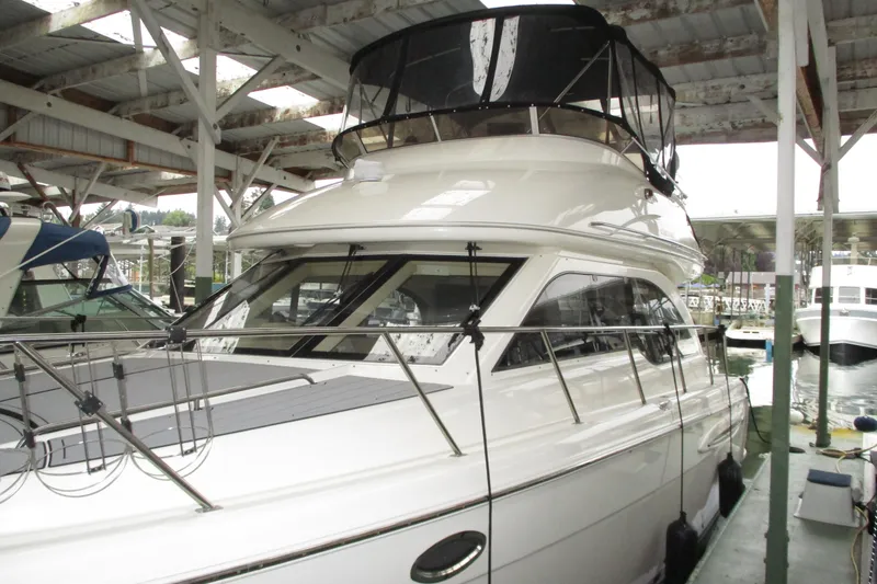 Slide: The Image of 2004 Meridian 340 yacht docked in a covered marina. - 8