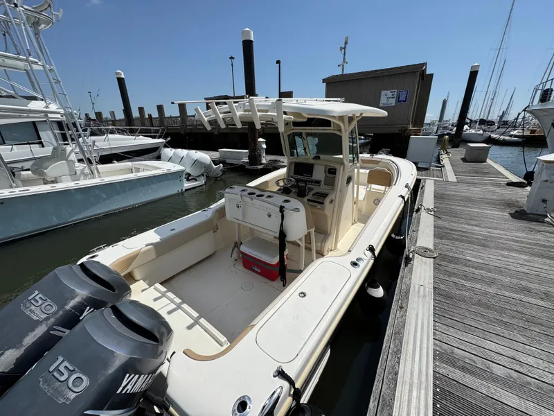 Slide: The Image of 2012 Scout 262 XSF boat docked with dual Yamaha engines, ready for a marine adventure. - 5