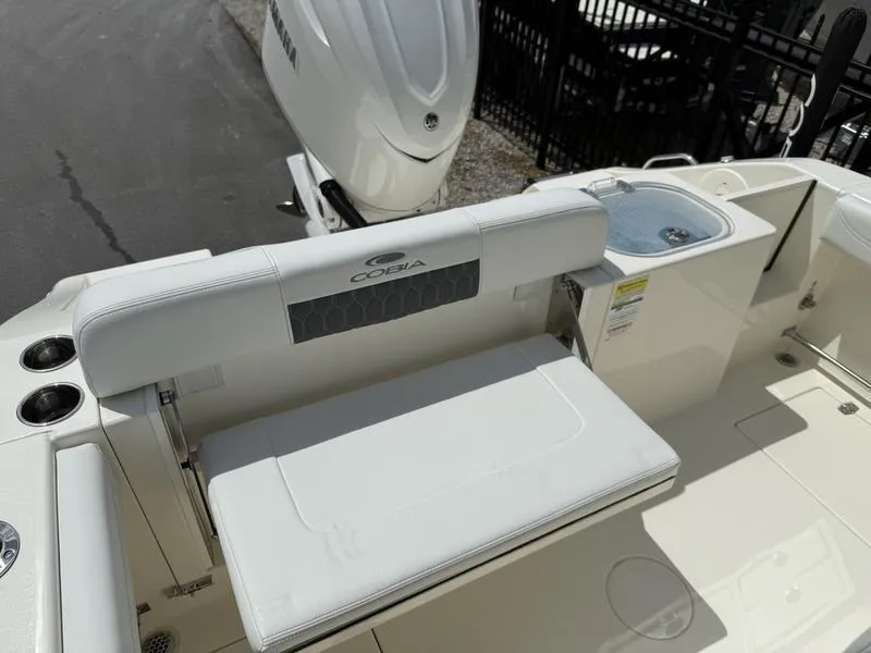 Slide: The Image of 2025 Cobia 240 Center Console boat with seating and storage features. - 13