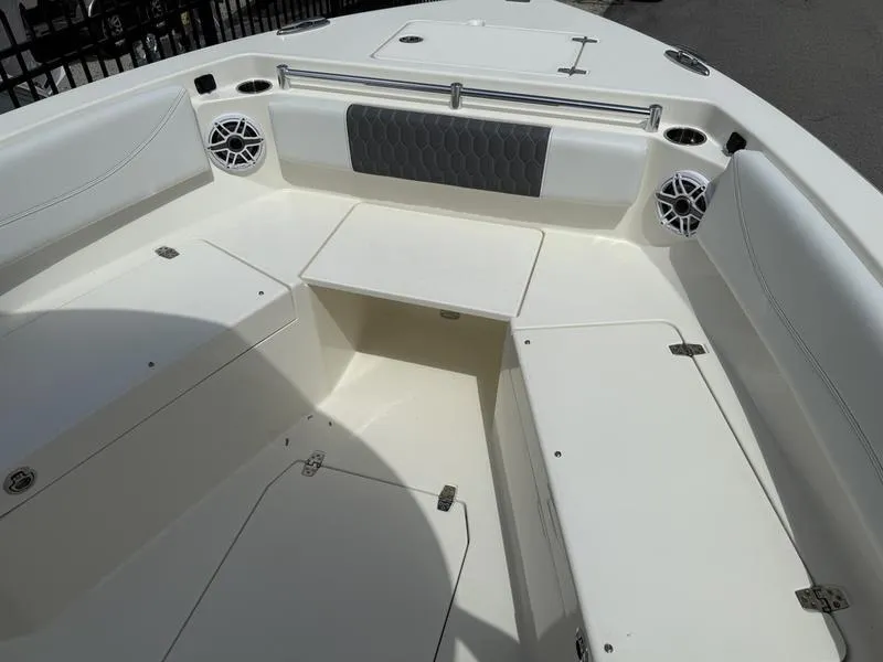 Slide: The Image of 2025 Cobia 240 Center Console boat interior with seating and storage compartments. - 6