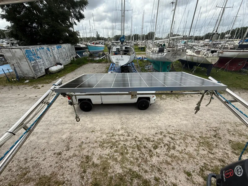 Slide: The Image of 1981 S2 11A sailboat in marina, surrounded by other boats, under cloudy sky. - 13