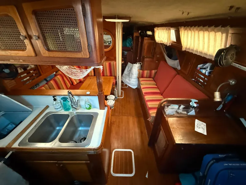 Slide: The Image of Interior of a 1981 S2 11A sailboat with wood finish and striped seating. - 36