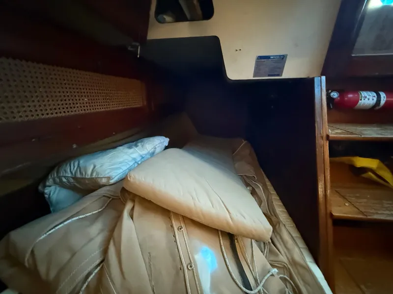 Slide: The Image of Cozy cabin interior of 1981 S2 11A sailboat with cushions and fire extinguisher. - 41