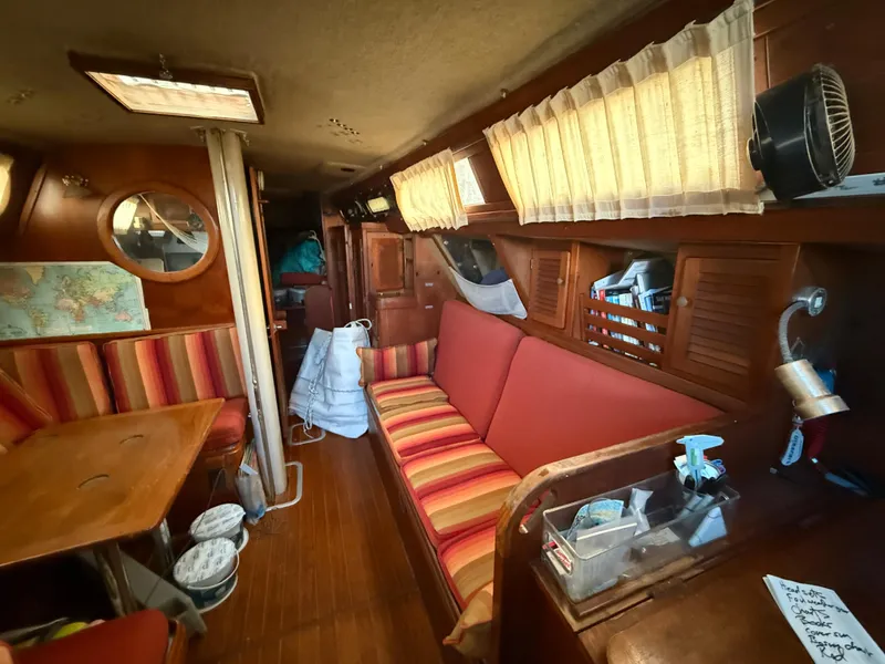 Slide: The Image of Interior of a 1981 S2 11A sailboat with cozy seating and wooden decor. - 43