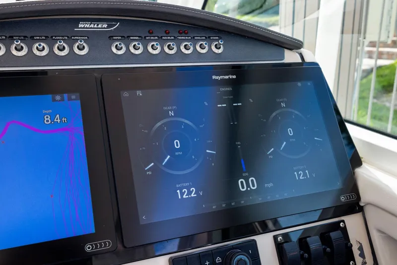 Slide: The Image of Dashboard of 2022 Boston Whaler 320 Vantage with digital navigation displays. - 27
