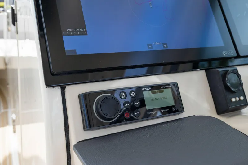 Slide: The Image of Control panel of 2022 Boston Whaler 320 Vantage with display and audio system. - 30