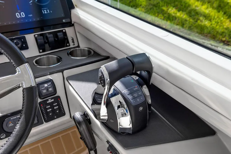 Slide: The Image of Control panel of 2022 Boston Whaler 320 Vantage boat with throttle and display. - 32