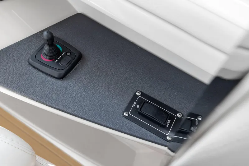 Slide: The Image of Control panel of 2022 Boston Whaler 320 Vantage boat, featuring joystick and switch. - 34