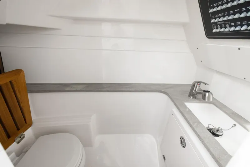 Slide: The Image of 2022 Boston Whaler 320 Vantage boat interior with sink and toilet. - 43