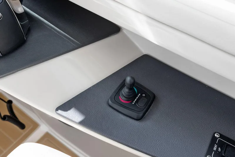 Slide: The Image of Joystick control on 2022 Boston Whaler 320 Vantage boat dashboard. - 47