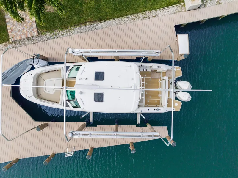 Slide: The Image of Overhead view of a 2022 Boston Whaler 320 Vantage docked at a marina. - 8