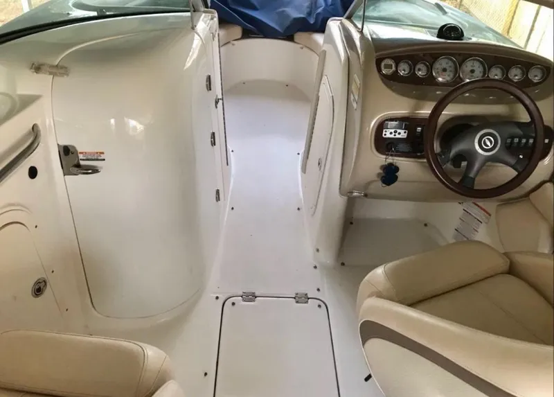 Slide: The Image of 2007 Chaparral Sunesta 234 boat interior with steering wheel and dashboard controls. - 6