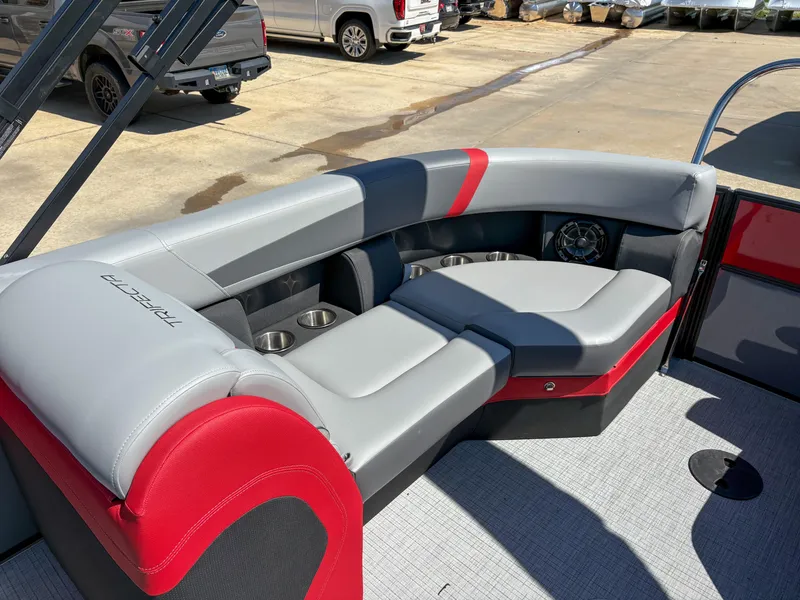 Slide: The Image of Luxurious seating on 2025 Trifecta 22RF CS pontoon boat with red and gray upholstery. - 11