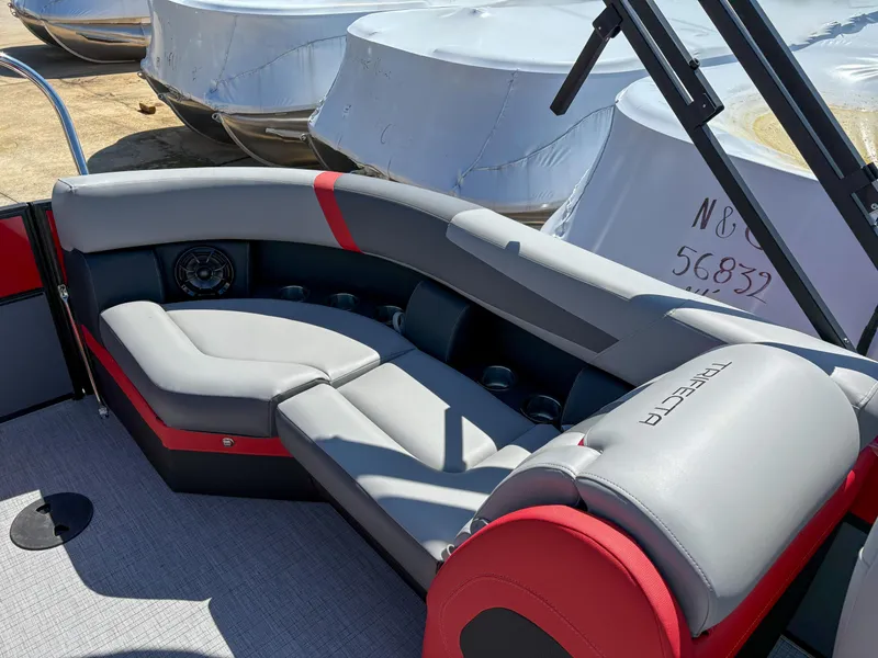 Slide: The Image of 2025 Trifecta 22RF CS pontoon boat interior with gray and red seating. - 12