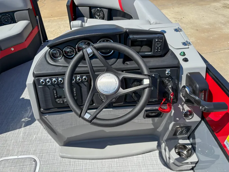 Slide: The Image of Steering console of 2025 Trifecta 22RF CS boat with modern controls and gauges. - 14