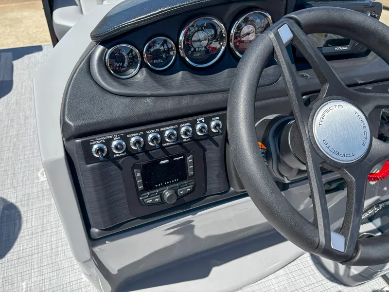 Slide: The Image of Steering console of 2025 Trifecta 22RF CS boat with gauges and controls. - 15