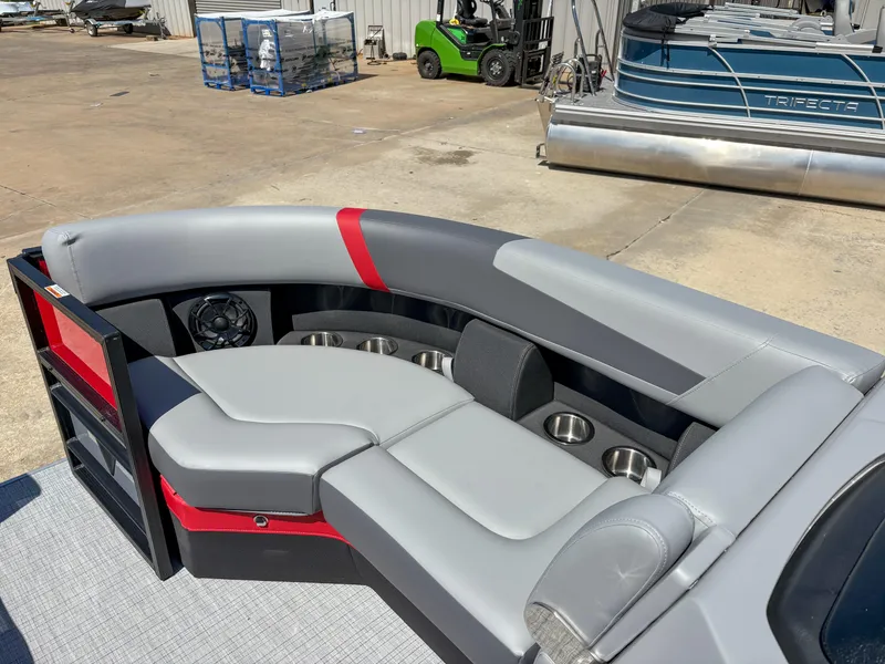Slide: The Image of Luxurious seating on 2025 Trifecta 22RF CS pontoon boat with modern design and cup holders. - 7