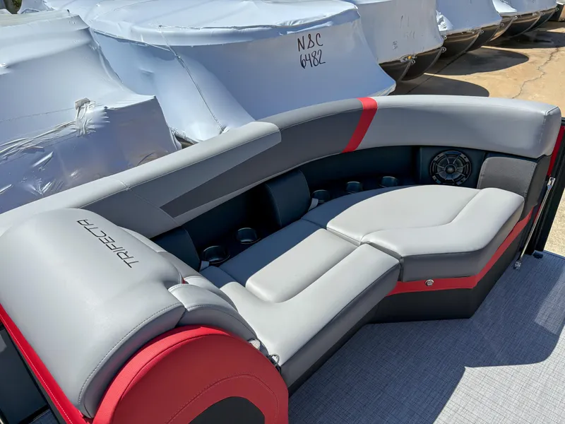 Slide: The Image of Luxurious seating on 2025 Trifecta 22RF CS pontoon boat, featuring sleek gray and red design. - 8