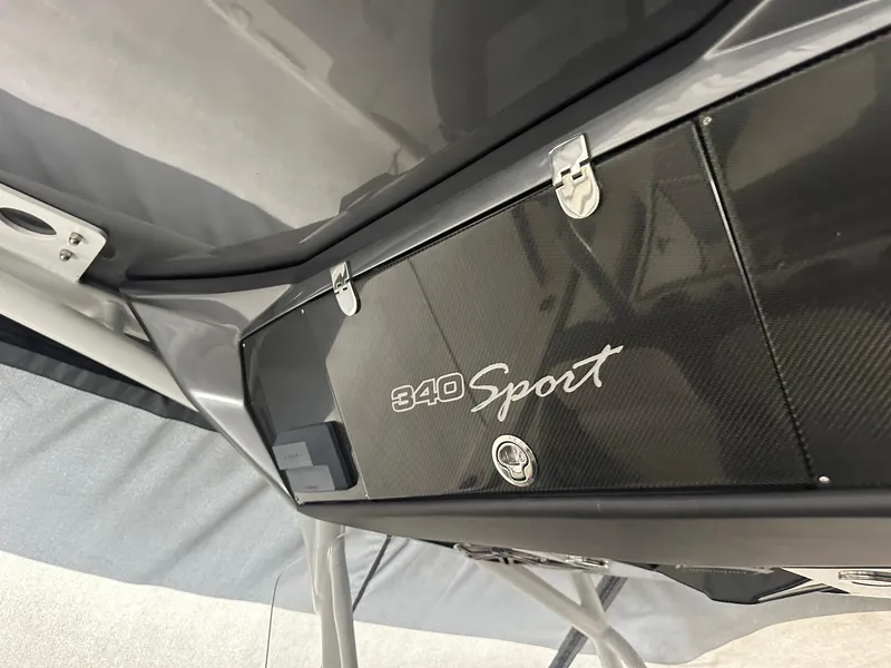 Slide: The Image of 2018 Nor-Tech 340 Sport boat, sleek design with carbon fiber detailing. - 10