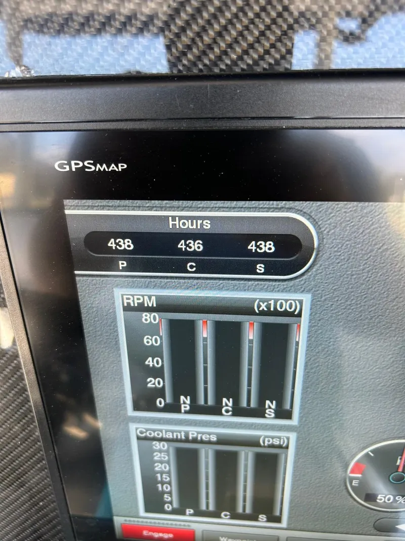 Slide: The Image of Dashboard display of a 2018 Nor-Tech 340 Sport showing engine hours and RPM gauges. - 17