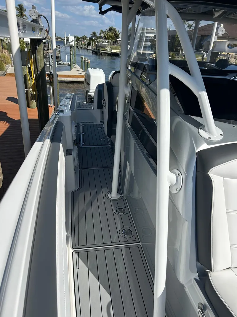 Slide: The Image of 2018 Nor-Tech 340 Sport boat with sleek deck design and modern features. - 20