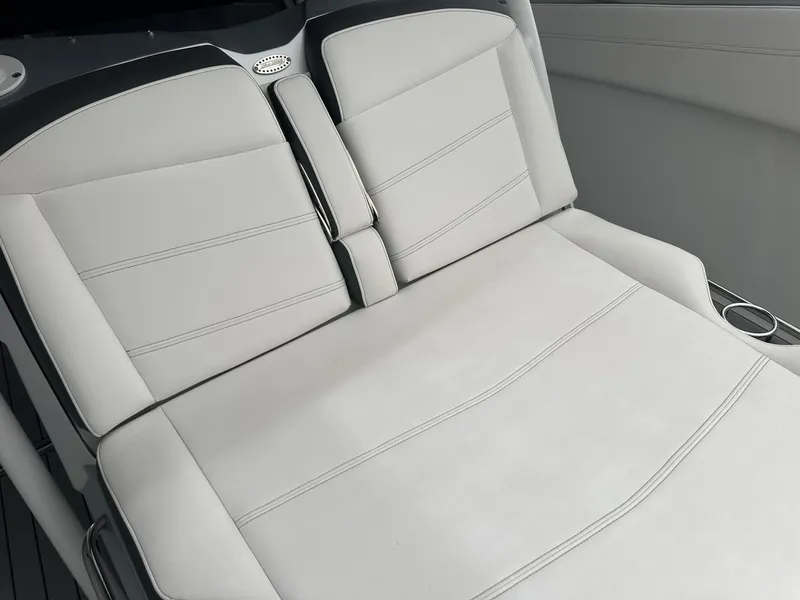 Slide: The Image of Luxurious seating on 2018 Nor-Tech 340 Sport boat, featuring sleek white upholstery. - 23