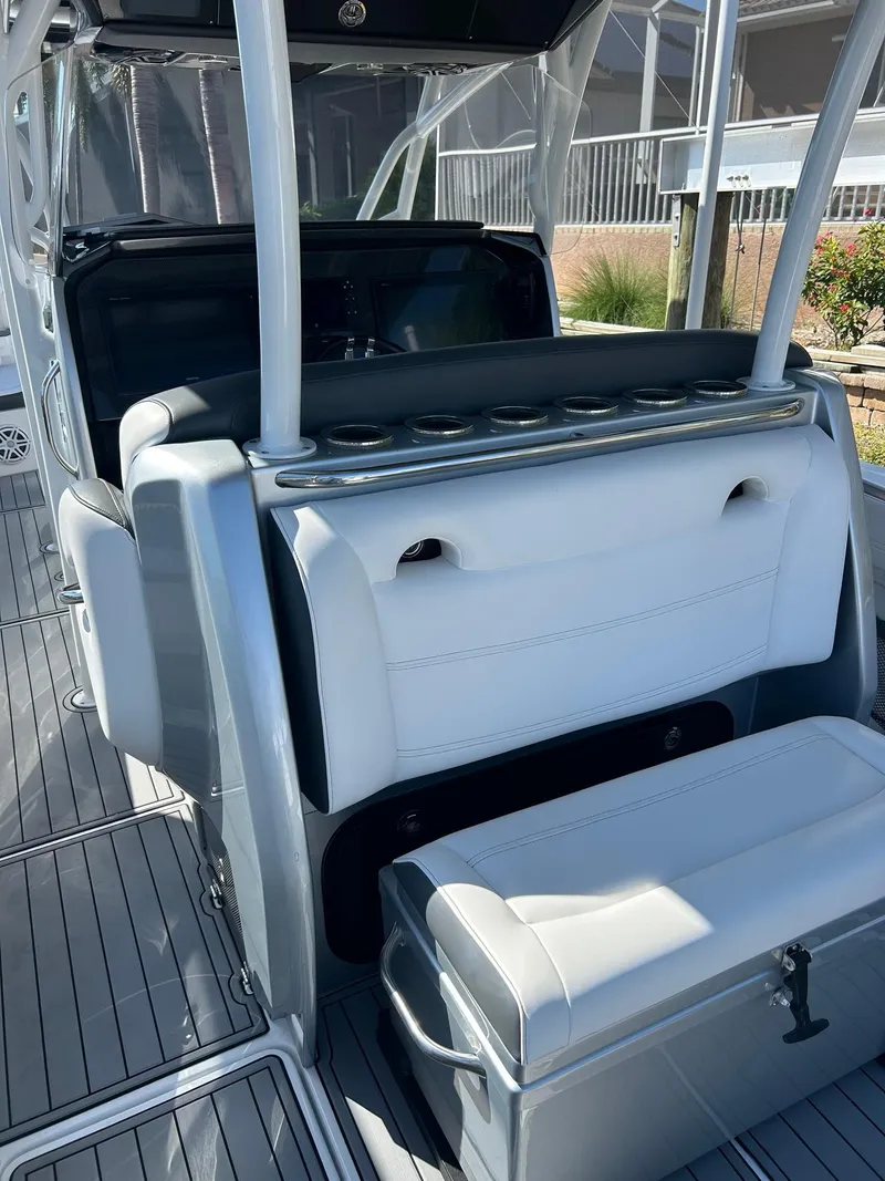 Slide: The Image of 2018 Nor-Tech 340 Sport boat interior with sleek seating and modern design. - 24