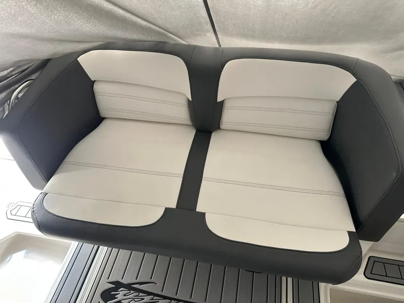 Slide: The Image of 2018 Nor-Tech 340 Sport boat seat with black and white upholstery. - 4