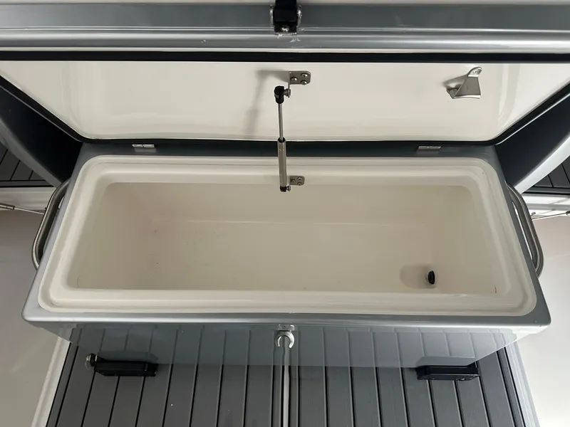 Slide: The Image of Open storage compartment on 2018 Nor-Tech 340 Sport boat, featuring a sleek design. - 9