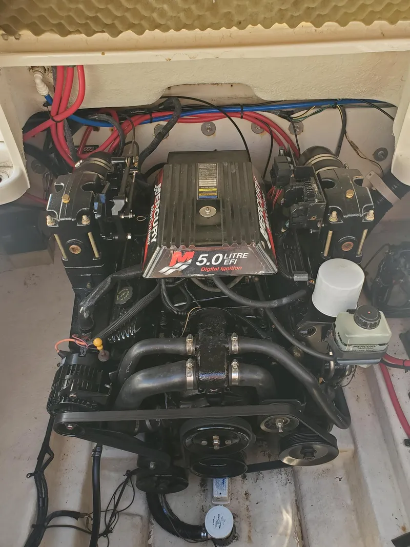 Slide: The Image of Engine compartment of a 2001 Sea Ray 245 Weekender with a 5.0-liter MerCruiser engine. - 17