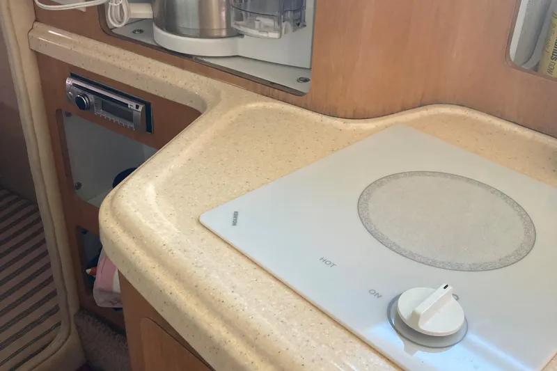 Slide: The Image of 2001 Chris-Craft 26 Constellation boat interior with stove and countertop. - 6