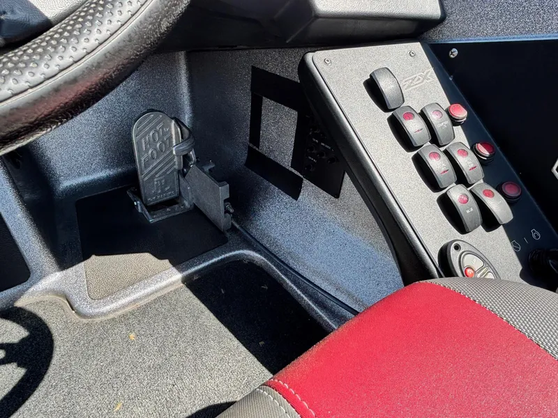 Slide: The Image of 2019 Skeeter ZX 250 boat interior with control panel and foot pedal. - 10