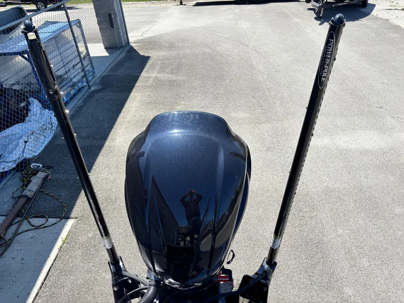 Slide: The Image of 2019 Skeeter ZX 250 boat engine with dual power poles on a sunny day. - 14