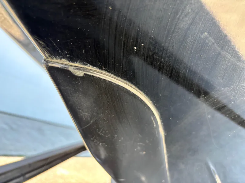 Slide: The Image of Close-up of a 2019 Skeeter ZX 250 boat's sleek, black surface detail. - 3