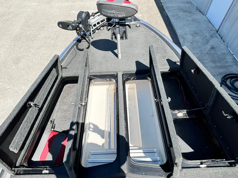 Slide: The Image of 2019 Skeeter ZX 250 boat deck with open storage compartments and seating. - 7